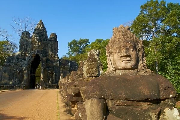 Statues of giants holding the sacred naga, South Entry Gate, Angkor Thom