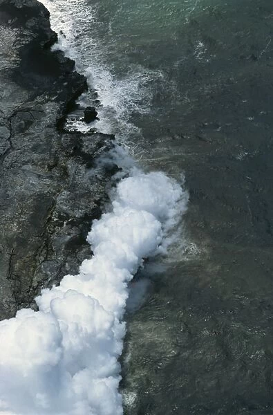 Steam cloud rising where lava from the Pu u O o cinder cone far inland enters sea on southeast Puna coast near Kaimu, Big Island, Hawaii, Hawaiian Islands, United States of America, Pacific