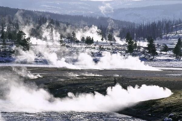 Steam from hot springs and snow-free hot ground in
