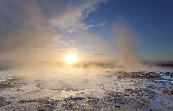 Steam rising from geothermal pools at sunrise in winter, Geysir, Haukardalur Valley, Iceland, Polar Regions