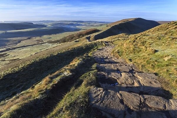 Steps up Mam Tor, view towards Rushup Edge, distant fields and hills in winter, Castleton, Peak District, Derbyshire, England, United Kingdom, Europe