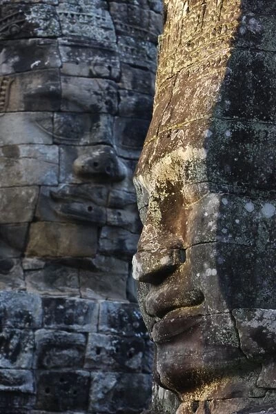 Stone faces, which may depict Jayavarman VII as a Bodhisattva, on towers in the Bayon Temple