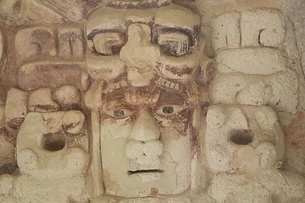 Stone mask of Mayan Sun God Kinichna, taken through protective glass, Becan, Mayan Ruins