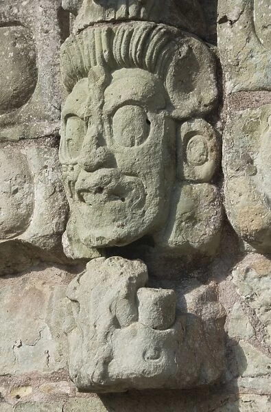 Stone sculptured face of the God of the Underworld, East Court, Copan Archaeological Park