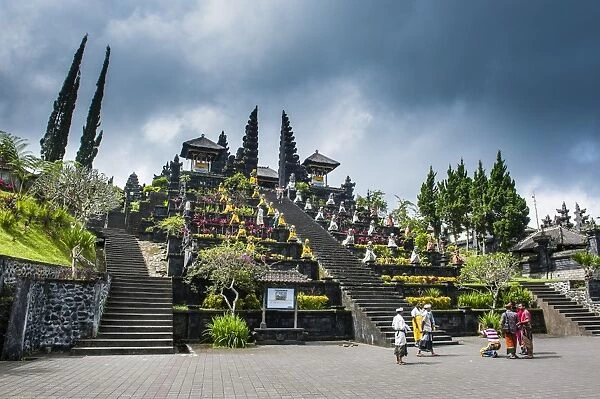 Stone statues with colourful capes in the Pura Besakih temple complex, Bali, Indonesia, Southeast Asia, Asia