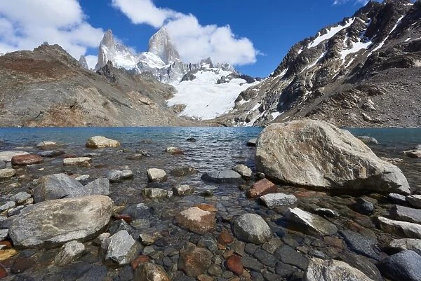 Stones seen through the water of Lago de los Tres featuring Monte Fitz Roy in the background