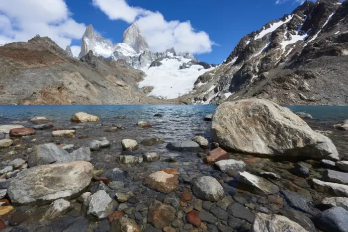 Framed Print : Stones seen through the water of Lago de los Tres featuring Monte Fitz Roy in the background Framed Print : Stones seen through the water of Lago de los Tres featuring Monte Fitz Roy in the background