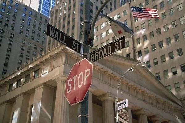 Stop sign at junction of Wall Street and Broad Street, New York City, United States of America