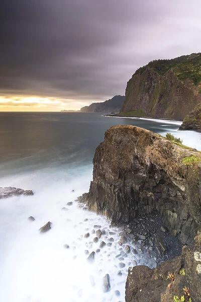 Storm clouds over the Atlantic Ocean and cliffs at dawn, Madeira island, Portugal