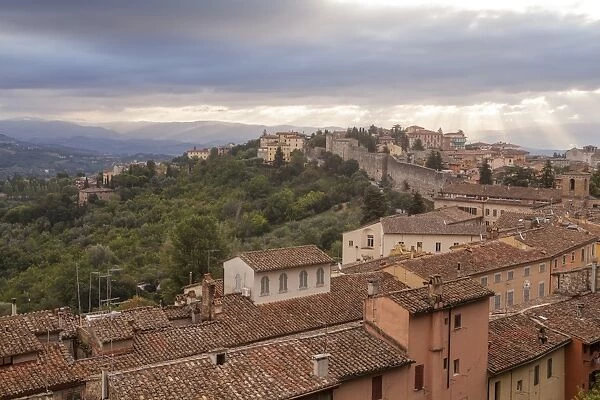 Storm clouds clearning over Perugias historic centre, Perugia, Umbria, Italy, Europe