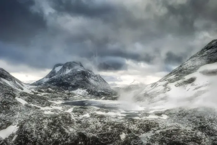 Framed Print : Storm clouds over Olaskarsvatnet lake at feet of the snowcapped Olaskarstind mountain Framed Print : Storm clouds over Olaskarsvatnet lake at feet of the snowcapped Olaskarstind mountain