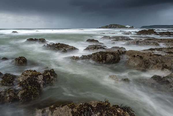 Stormy conditions on the rocky Bantham coast in autumn, looking across to Burgh Island