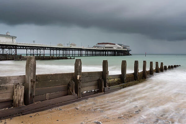 A stormy sky over the beach and pier at Cromer, Norfolk, England, United Kingdom, Europe