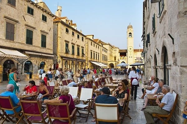 Stradun, the famous street in Dubrovnik, tourists in a cafe by the City Bell Tower, Old Town, UNESCO World Heritage Site, Dubrovnik, Dalmatia, Croatia, Europe