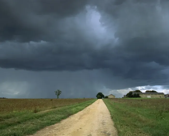 Framed Print : Straight rural dirt road through farmland near Le Mans, overcast stormy sky Framed Print : Straight rural dirt road through farmland near Le Mans, overcast stormy sky