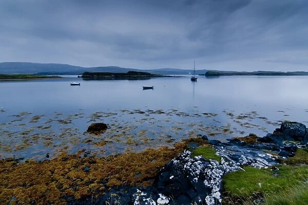 Strange twilight seascape of Loch Dunvegan on the Isle of Skye, Inner Hebrides, Scotland, United Kingdom, Europe