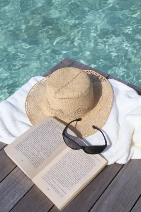 Framed Print : Straw hat, book and sunglasses on towel Framed Print : Straw hat, book and sunglasses on towel
