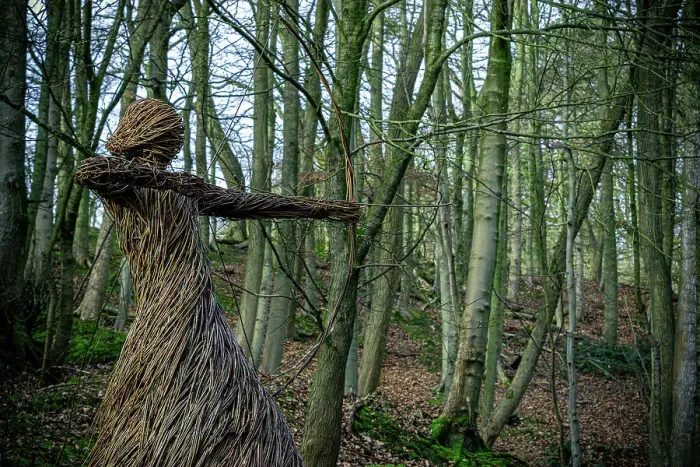 Framed Print : Straw sculpture of a humanoid figure in a forest, with arms outstretched amidst bare trees, Skipton, Yorkshire, England, United Kingdom, Europe Framed Print : Straw sculpture of a humanoid figure in a forest, with arms outstretched amidst bare trees, Skipton, Yorkshire, England, United Kingdom, Europe