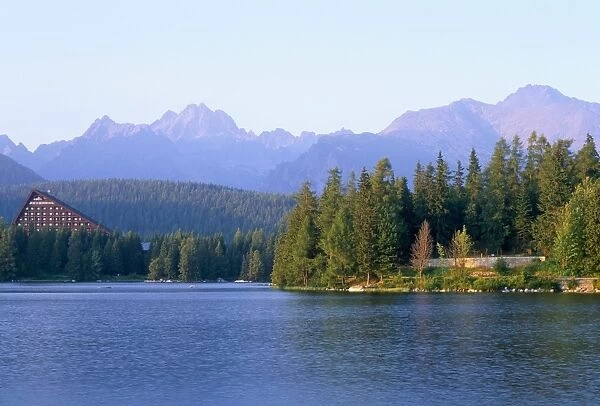 Strbske pleso (lake) and peaks of Vysoke Tatry mountains at sunset