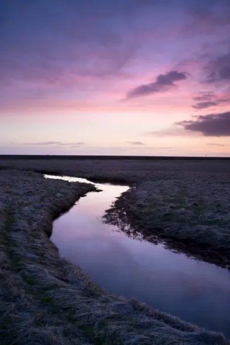 Framed Print : Stream meandering into the distance and reflecting colours in the twilight sky Framed Print : Stream meandering into the distance and reflecting colours in the twilight sky