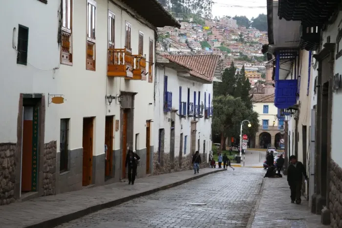 Framed Print : Side street in centre of Cusco City with outskirts of city on hill beyond, Cuzco