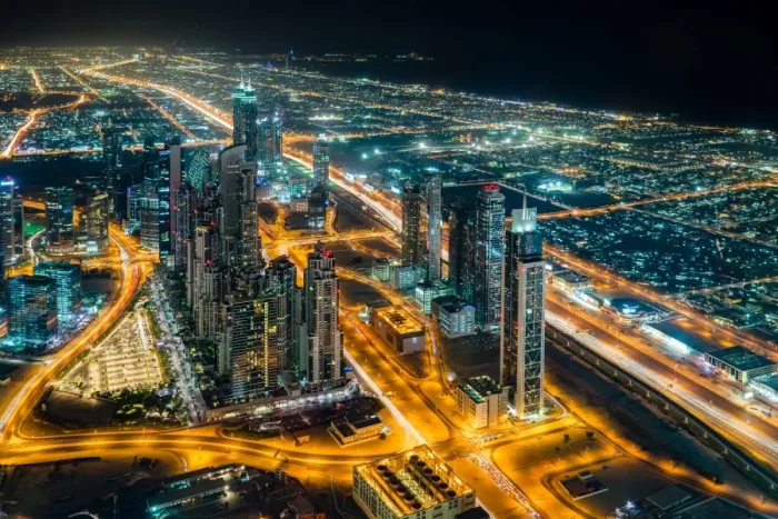 Framed Print : The street lights and skyscrapers of Dubai are seen at night from high above the city Framed Print : The street lights and skyscrapers of Dubai are seen at night from high above the city