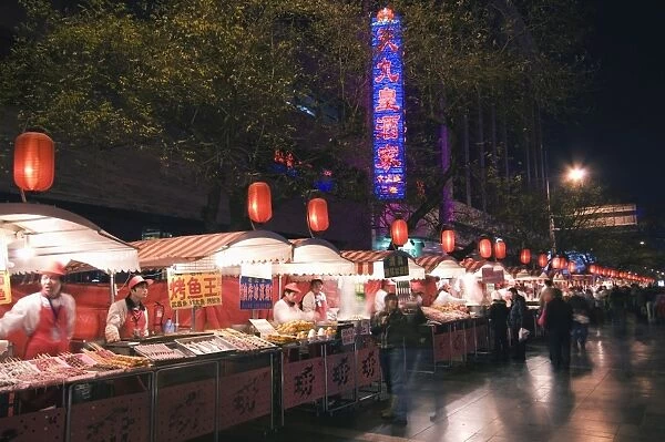 A street market selling local food in Wangfujing shopping street, Beijing, China, Asia