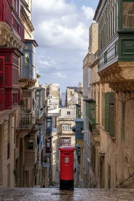 Framed Print : Street scene of alley with traditional homes, colourful balconies and a red post box, Valletta, Malta
