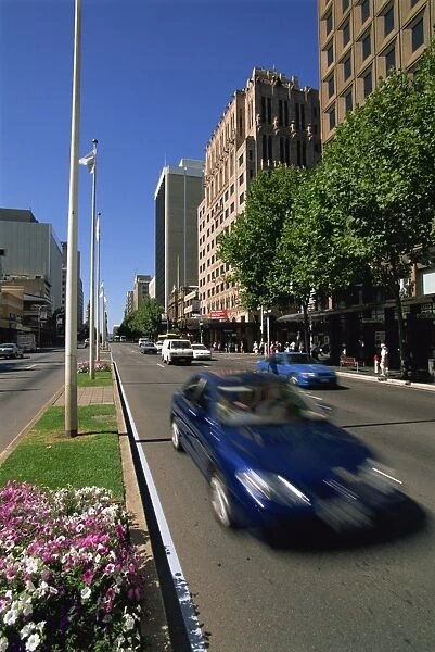 Street scene with cars at speed in the city, King William Street, Adelaide