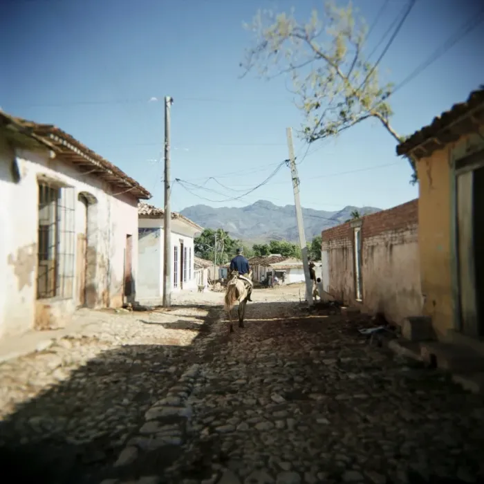 Framed Print : Street scene with man on horseback, Trinidad, Cuba, West Indies, Central America