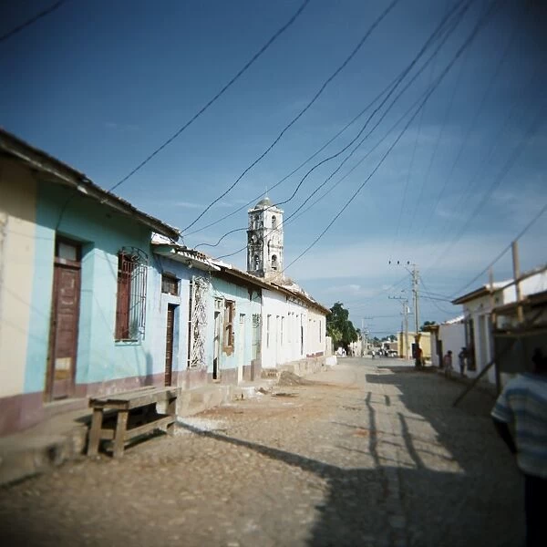 Street scene with old church in distance, Trinidad, Cuba, West Indies, Central America