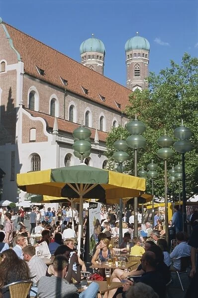 Street scene with pavement cafe and church in the pedestrian