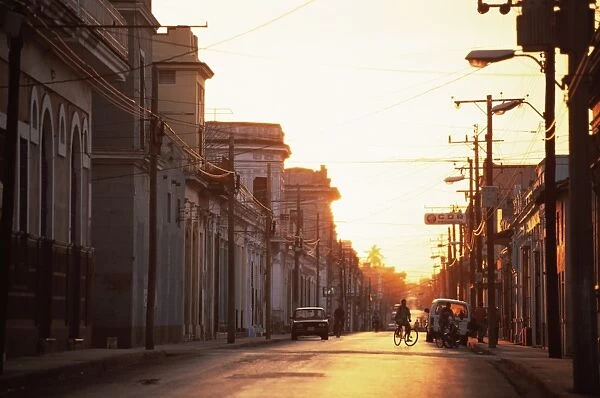 Street scene at sunrise, Cienfuegos, Cuba, West Indies, Central America