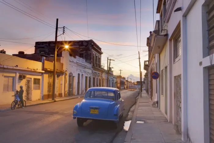 Framed Print : Street scene at twilight with classic blue American car, Cienfuegos, Cuba Framed Print : Street scene at twilight with classic blue American car, Cienfuegos, Cuba