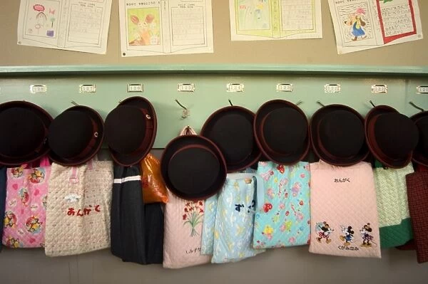 Student hats and bags hanging up