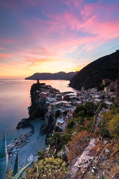 A stunning sunset over the old town and harbour of Vernazza, Cinque Terre, UNESCO