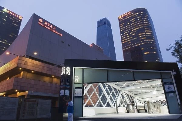 Subway station entrance in front of the World Trade Center Hotel and center buildings