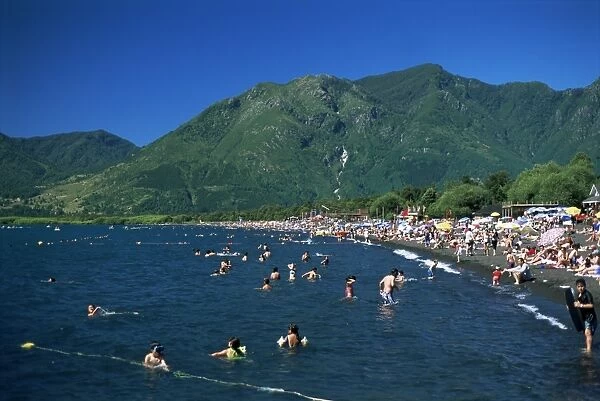 Summer crowds enjoy warm water, Lake Villarica, Lake District, Chile, South America