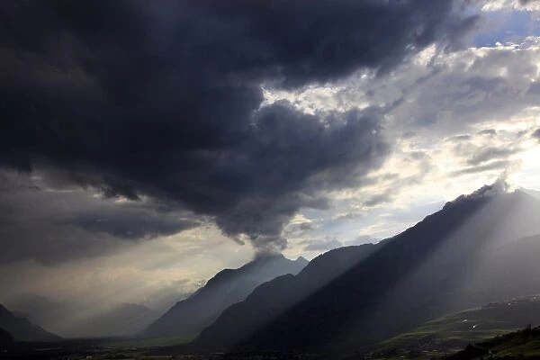 Summer storm clearing over the mountains of the Valais region, Swiss Alps, Switzerland, Europe