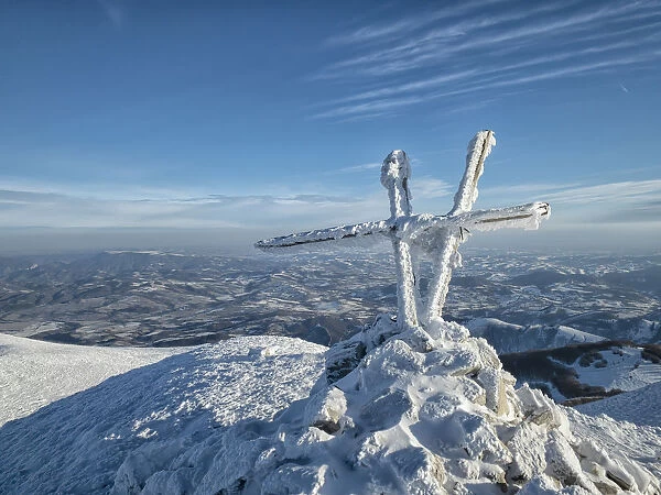 Summit cross of Mount Acuto in winter, Apennines, Umbria, Italy, Europe