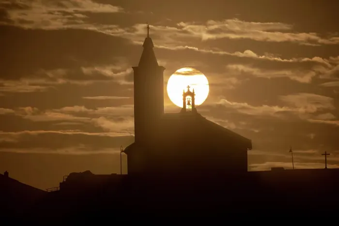 Framed Print : Sun aligned with the silhouette of the church of Luarca, Asturias, Spain, Europe Framed Print : Sun aligned with the silhouette of the church of Luarca, Asturias, Spain, Europe