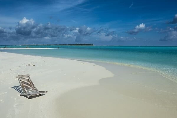Sun chair on a white sand beach and turquoise water, Sun Island Resort, Nalaguraidhoo island