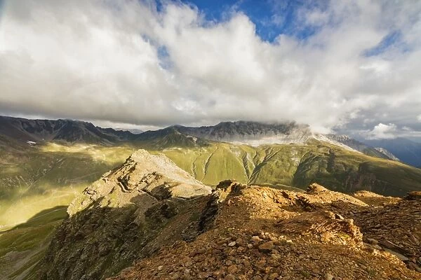 Sun and clouds on the rocky crest of the Alps, Filon del Mott, Bormio, Braulio Valley