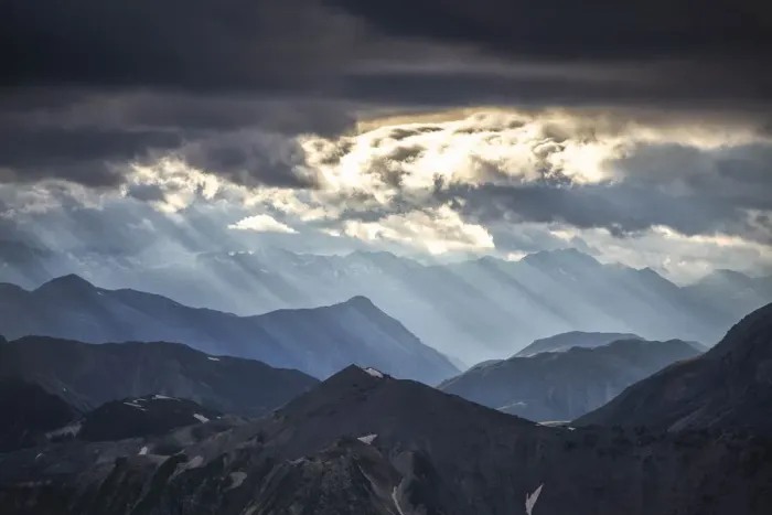 Framed Print : Sun rays filter between black clouds at sunset, Stelvio Mountain pass, Stelvio National Park, Valtellina, Lombardy, Italy, Europe Framed Print : Sun rays filter between black clouds at sunset, Stelvio Mountain pass, Stelvio National Park, Valtellina, Lombardy, Italy, Europe