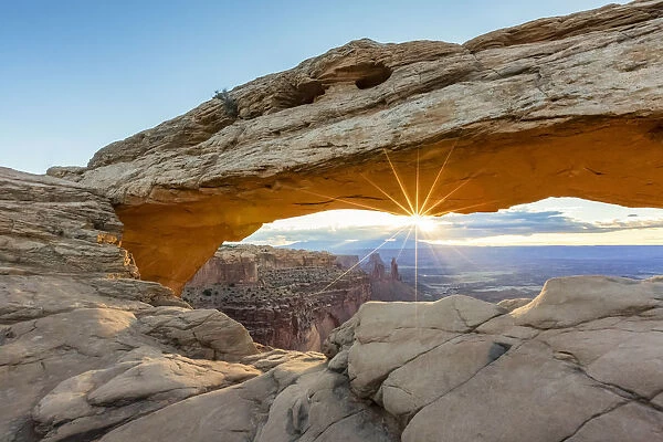 The sun is rising under Mesa Arch, Canyonlands National Park, Moab, Utah, United States of America