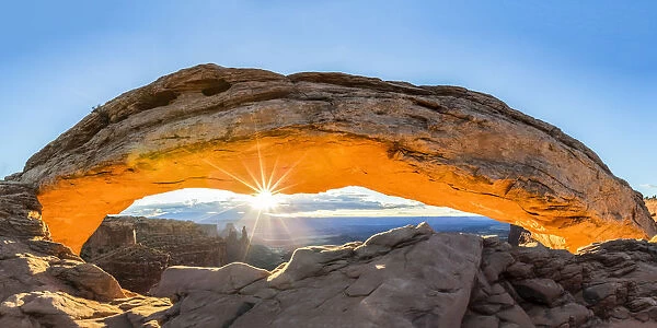 The sun rising under Mesa Arch, Canyonlands National Park, Moab, Utah, United States of America