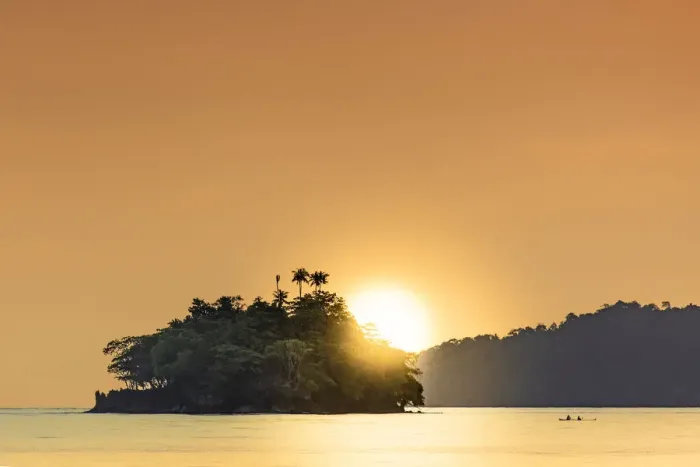 Framed Print : The sun setting behind islets in the Banda archipelago, Banda, Maluku, Spice Islands
