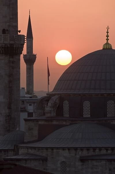 Sun setting behind Mahamut Pasha Mosque, Istanbul, Turkey, Europe