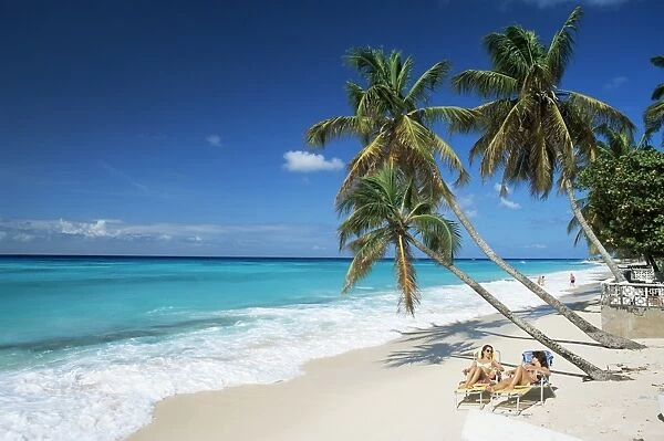 Sunbathers on Worthing Beach, on the south coast, Christ Church, Barbados