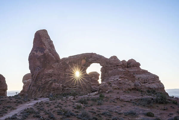 Sunburst through Turret Arch, Arches National Park, Utah, United States of America